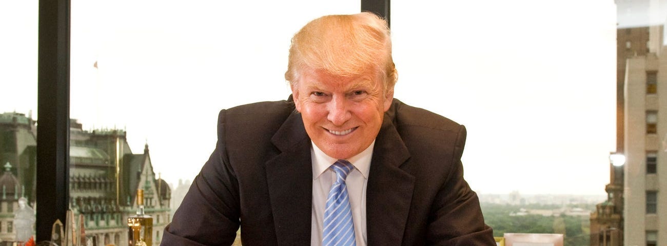 Donald Trump poses for photographs in his Trump Tower office on June 13, 2012, in New York.