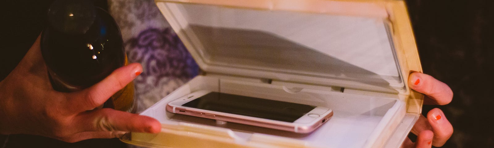 A photo of a iPhone being put away in a case.