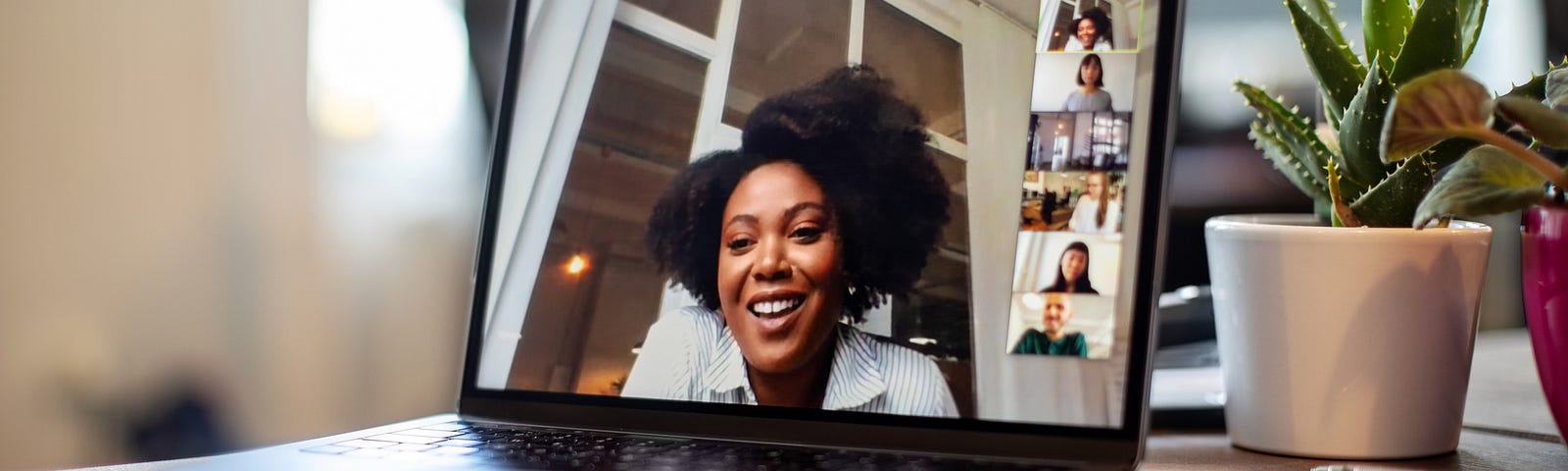 Businesswoman having a video call meeting with her team.