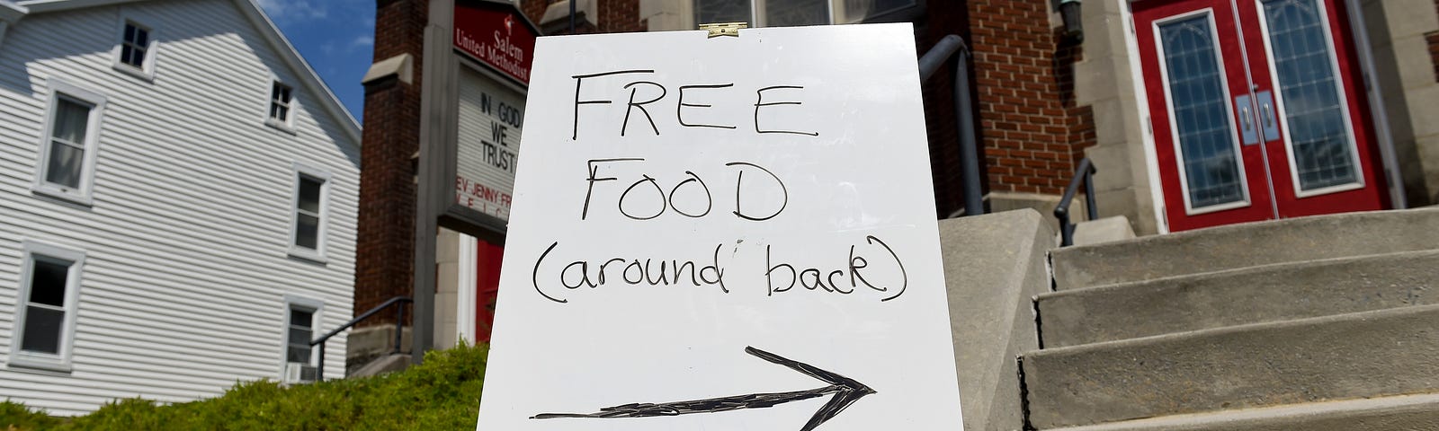 A “free food” sign in front of a church.