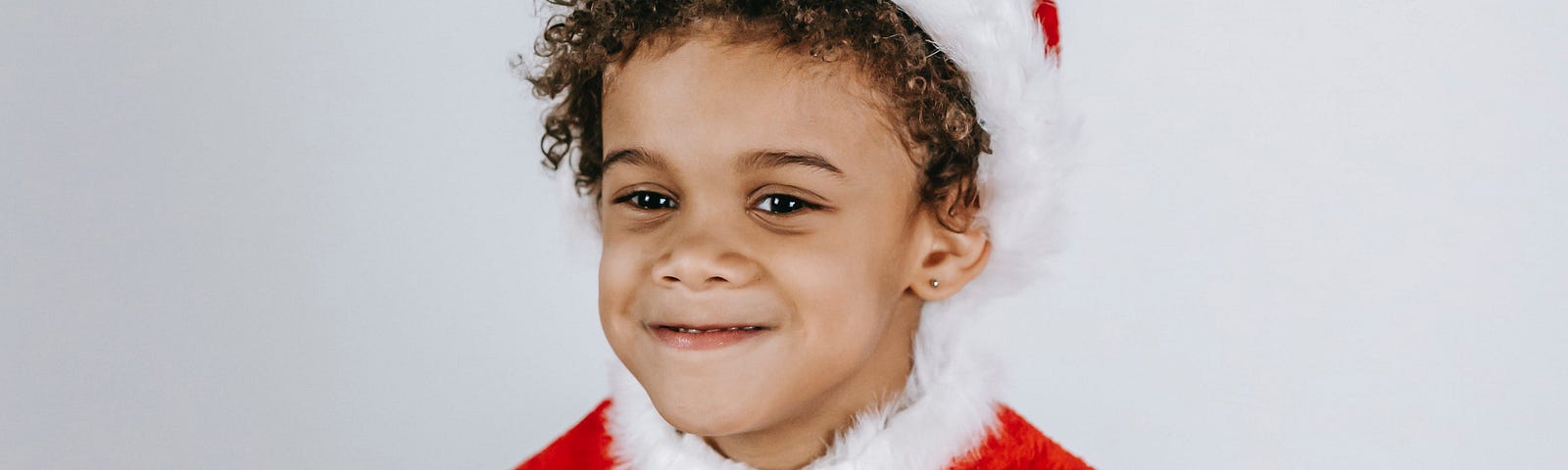 Kid wearing a Santa costume