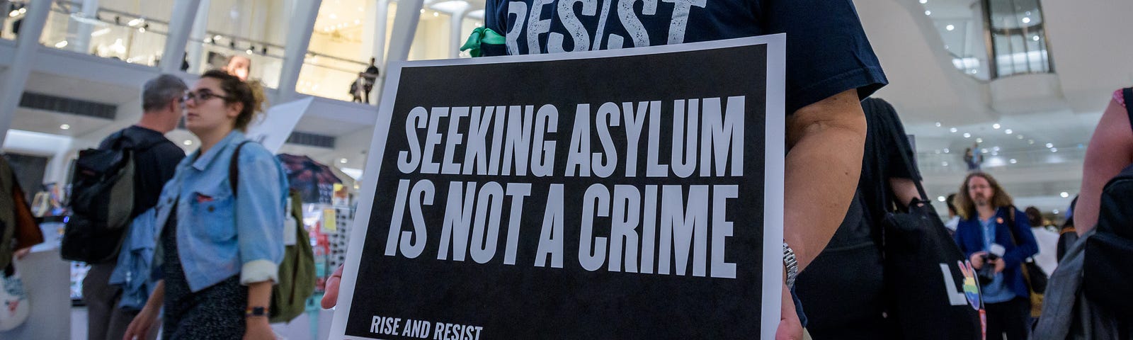 Members of the activist group Rise And Resist gathered at a silent protest inside The Oculus on September 12, 2019