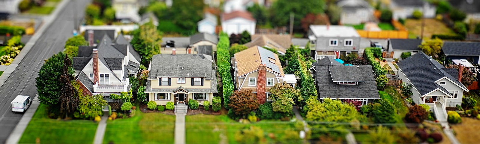 A diorama of a neighborhood with model homes