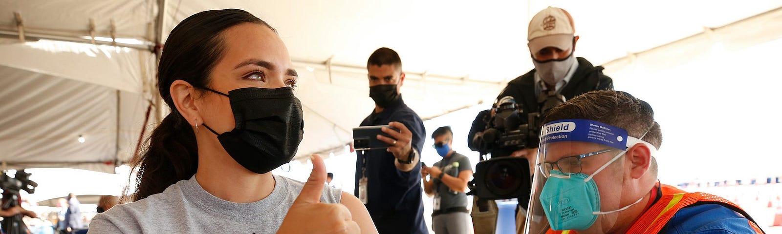 A woman receives a COVID-19 vaccine at a newly-opened vaccination site in Los Angeles, California on March 1, 2021.