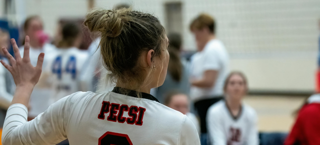 girl holding volleyball