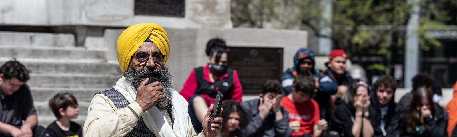 Maninder Singh Walia, a community member of the Sikh Satsang of Indianapolis, speaks during a vigil in Indianapolis on April 18, 2021.