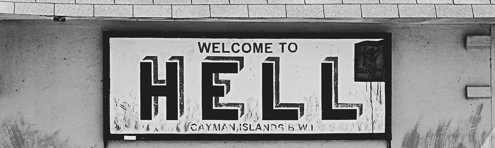 Photo of a sign that says, “Welcome to Hell.”