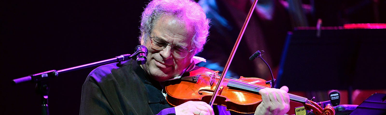 Itzhak Perlman performs at the Barclays Center on February 28, 2013 in New York City.