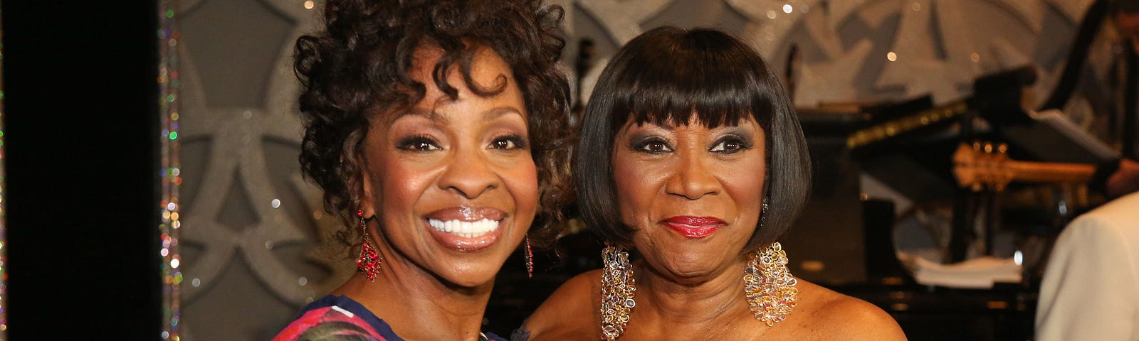 Gladys Knight and Patti Labelle pose for a photo together at an event.