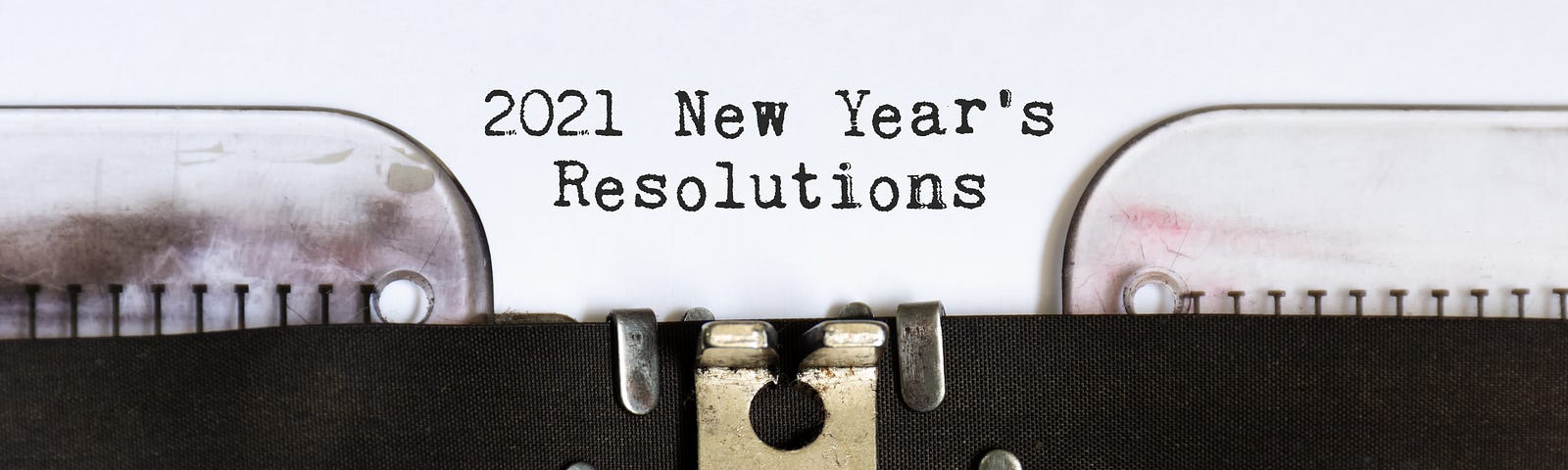 2021 New Year’s Resolutions typed by a typewriter.