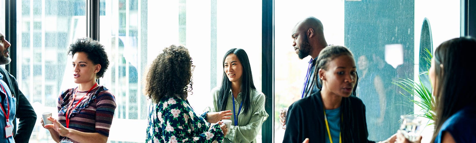 A group of individuals networking with each other at an event.