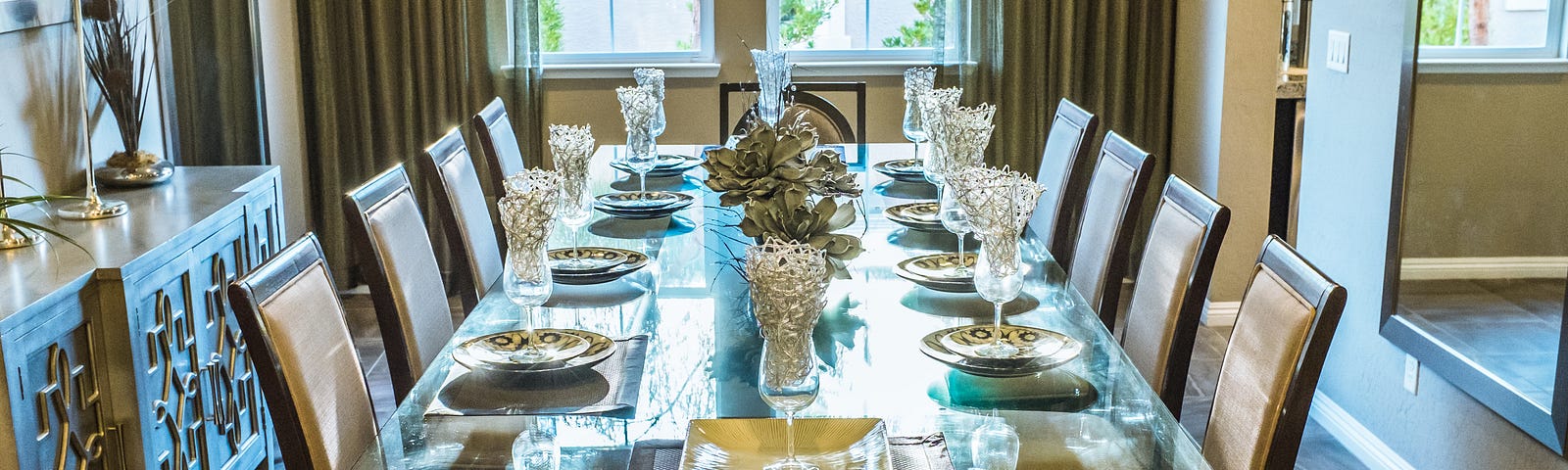 Long table decorated with nice cutlery.