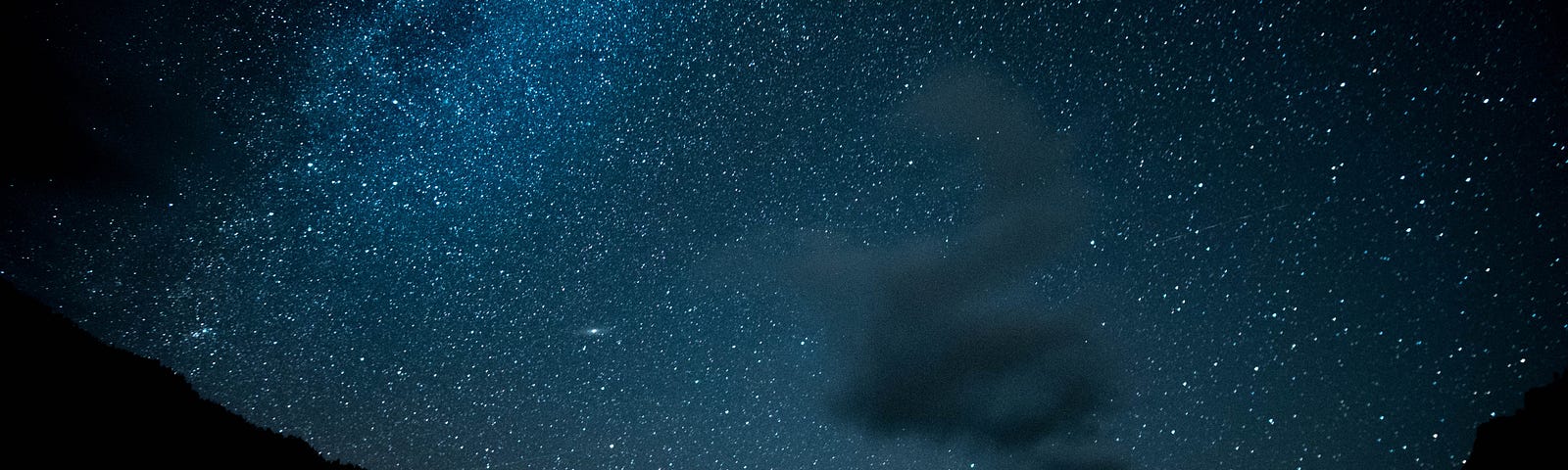 Night sky with squiggly cloud.