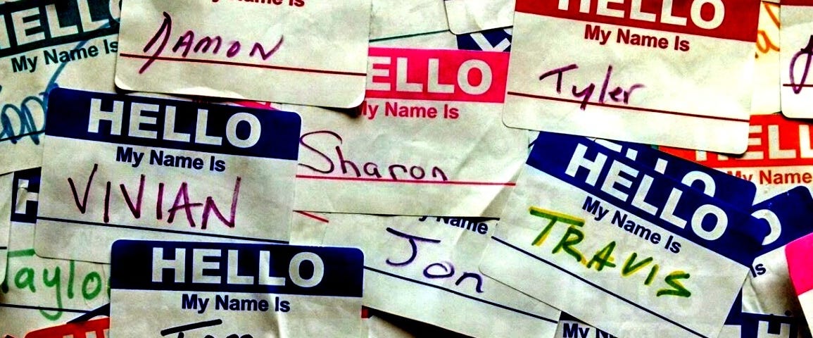 A collage of “Hello My Name Is” stickers with names such as: Damon, Sharon, Tom, Jon, Vivian, Travis, and Kristal.