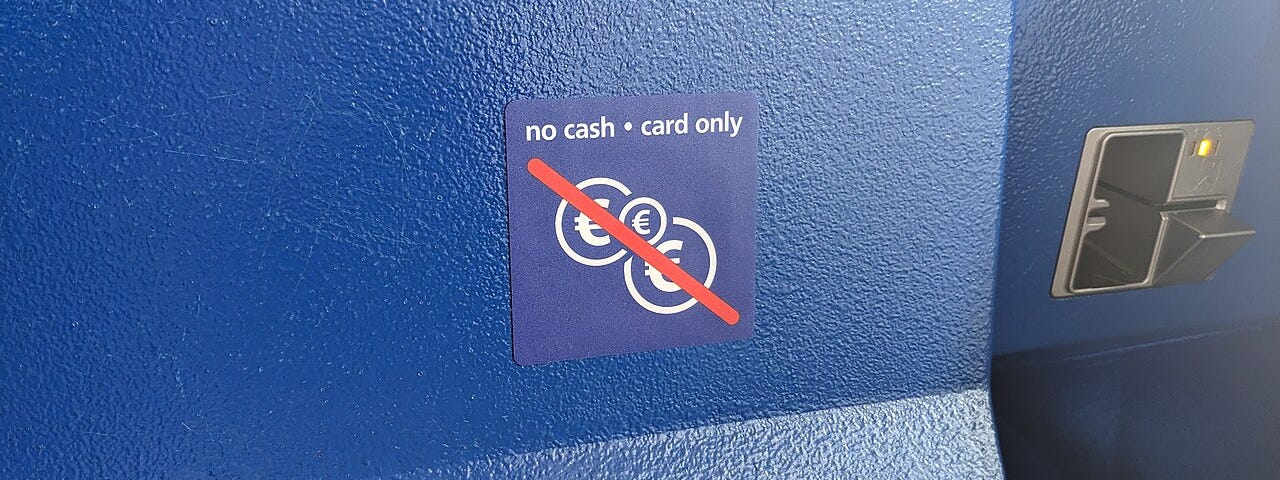 A photo of a sign saying no cash — card only