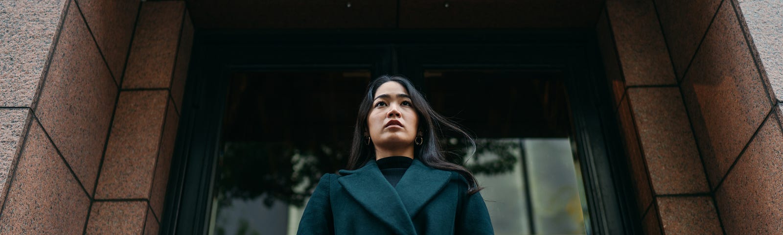 A photo of a young, Asian woman in winter clothes