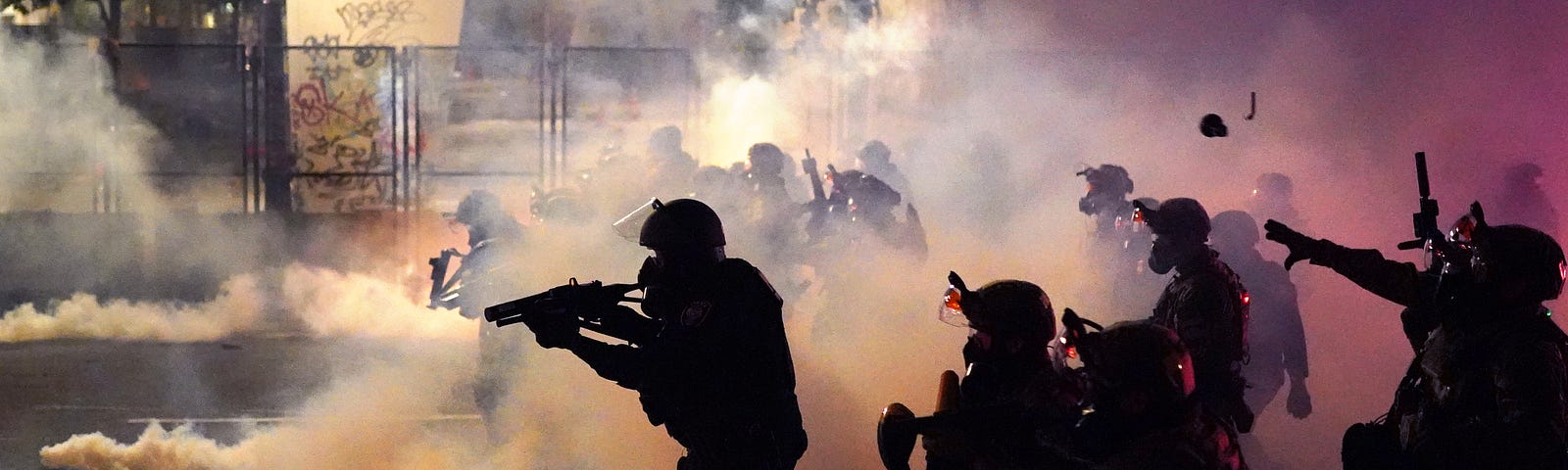 Federal officers deploy tear gas at protestors in front of the Mark O. Hatfield courthouse in Portland, Oregon.