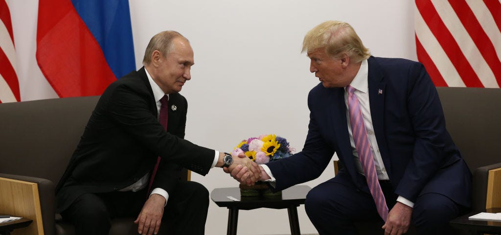 Russian President Vladimir Putin shaking hands with US President Donald Trump at the G20 summit in 2019.