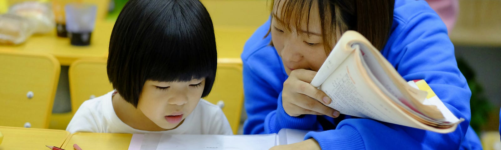 student and teacher working on a quiz