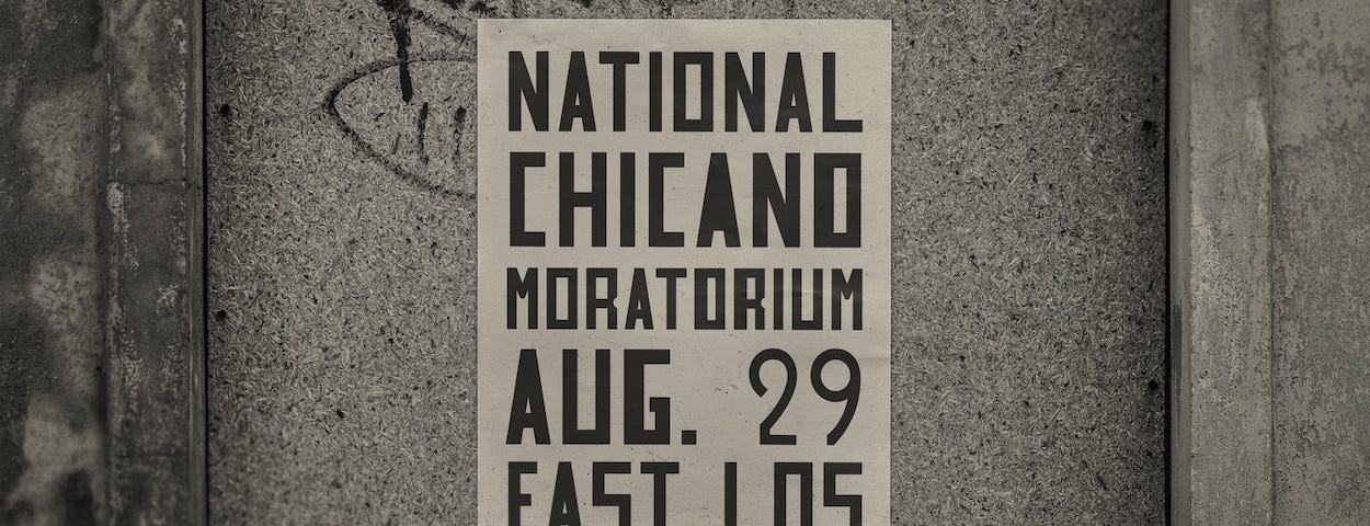 A poster with the words “National Chicano Moratorium, Aug. 29, East Los” in a large, block-y, sans-serif font.