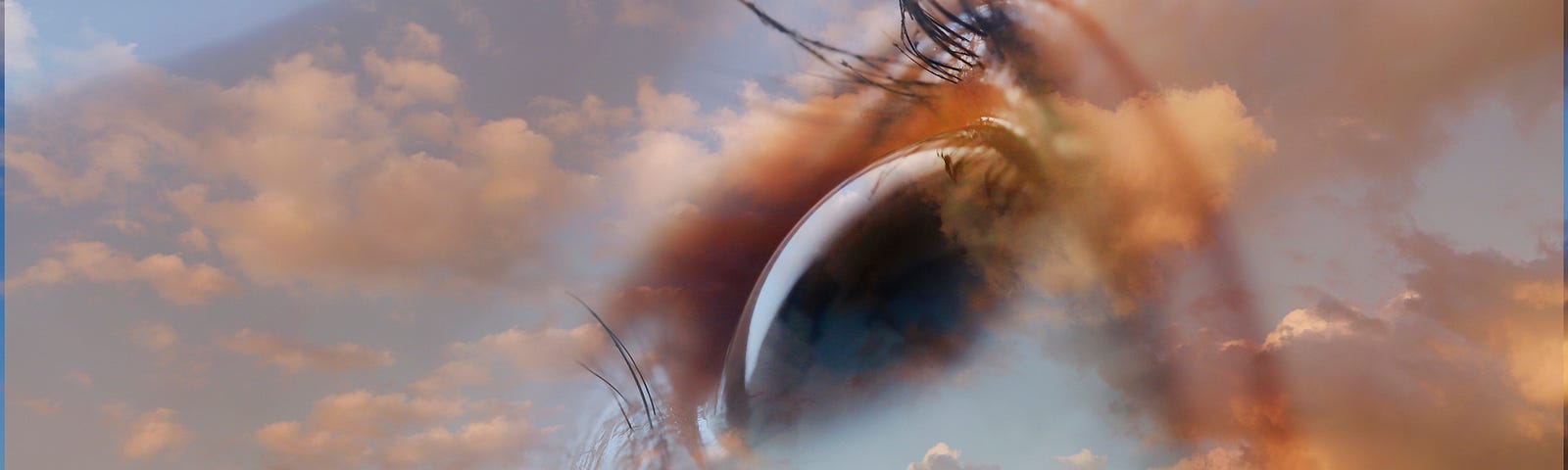 Double exposure image of a person’s eye against a cloudy sunset sky.