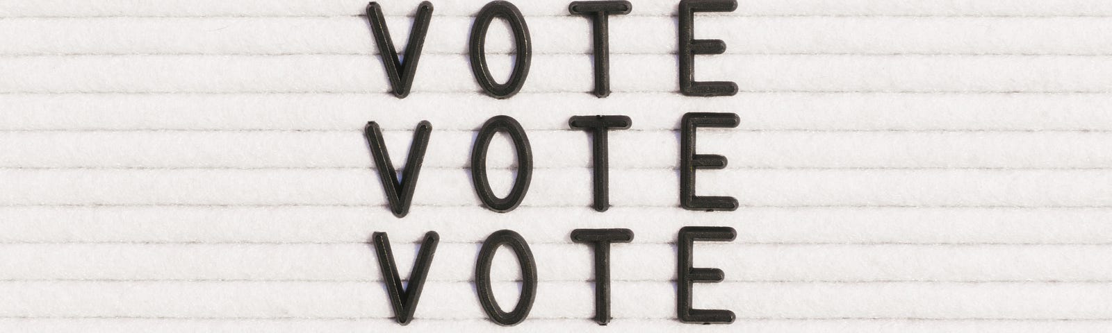 “Vote” written on a letter board.