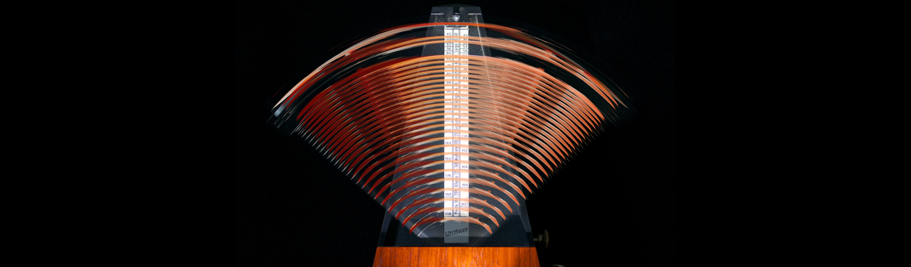 A time lapse photo of a metronome in motion.