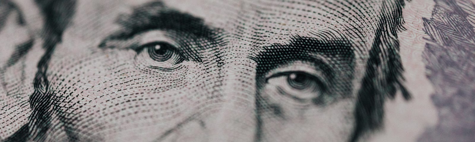 Picture of Abraham Lincoln’s eyes on the $5 bill.