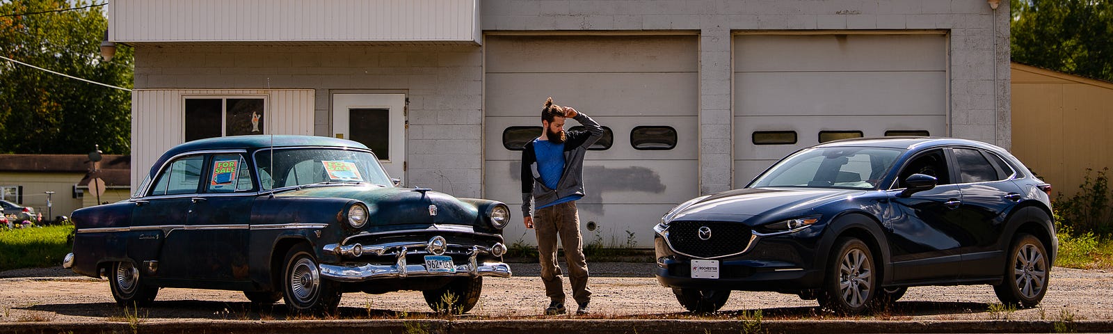 I look questioningly at my car parked next to an old beater, wondering why I chose the vehicle I did.