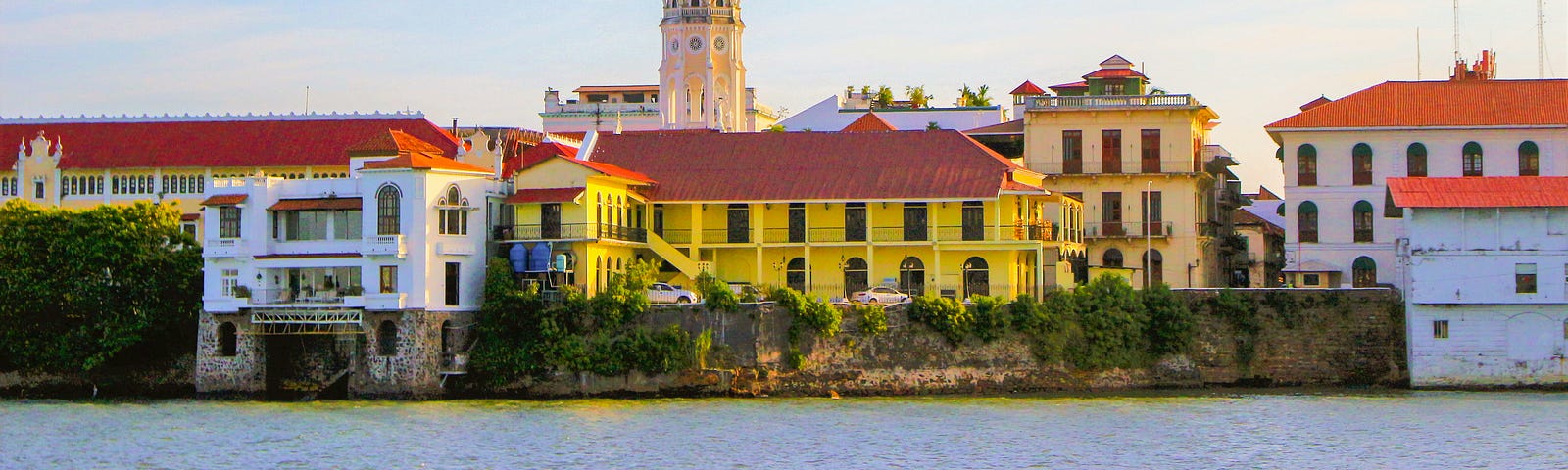 A riverfront view of Latin American colonial era buildings