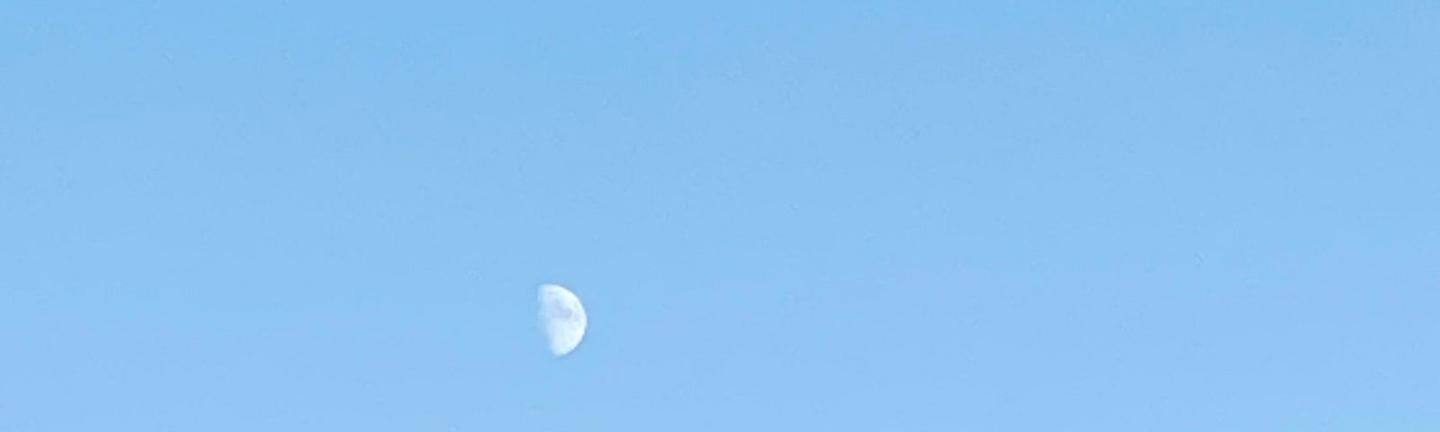 The moon in a blue sky