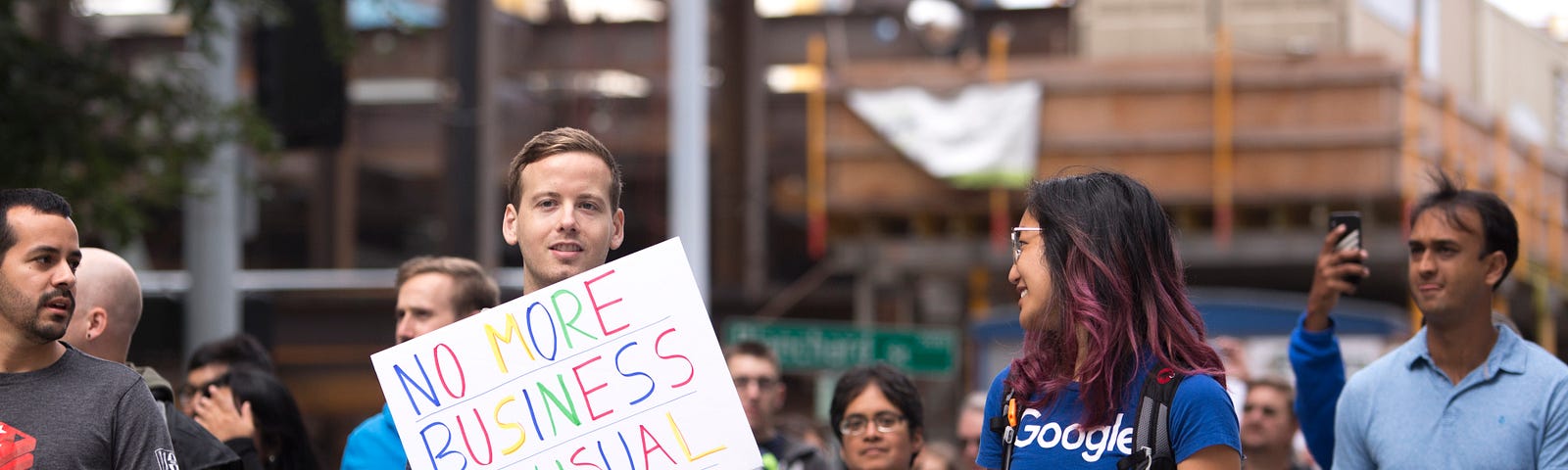 Tech workers and others arrive as Amazon Employees for Climate Justice lead a walkout and rally at the company’s headquarters