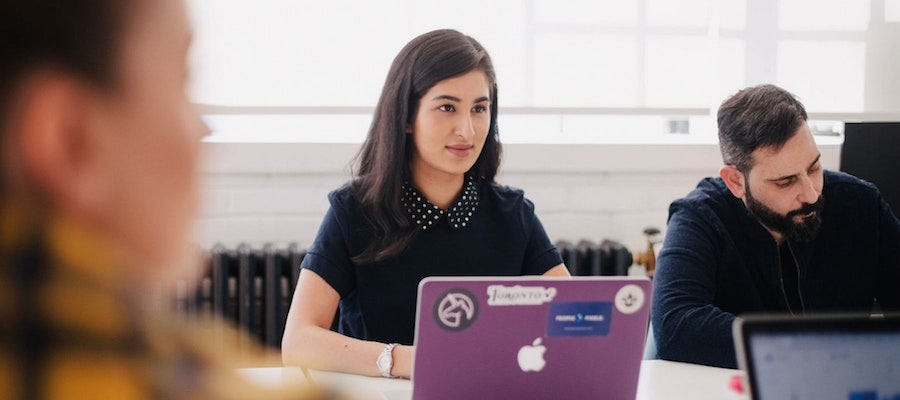 Lady with her laptop in a meeting