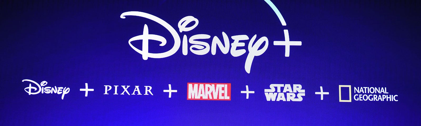 A screen announcing the Disney+ streaming service is seen at the D23 Expo.