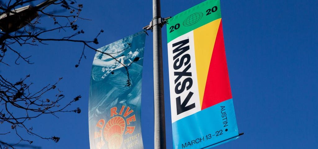 A photo of a SXSW banner on a pole in Austin, Texas.