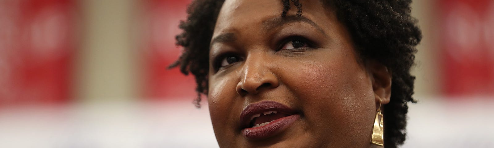 A closeup photo of Stacey Abrams speaking at an event.