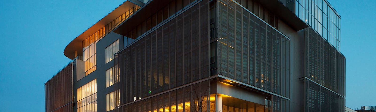 The MIT Media Lab building in Cambridge, Massachusetts, seen at twilight.