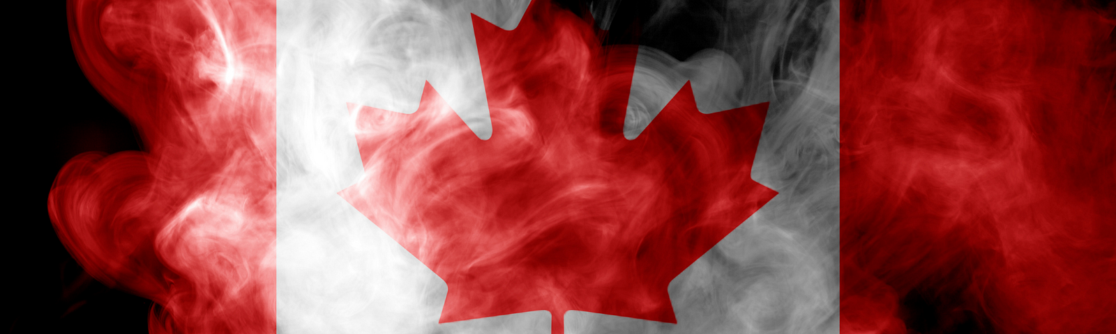 Canadian flag surrounded by white smoke