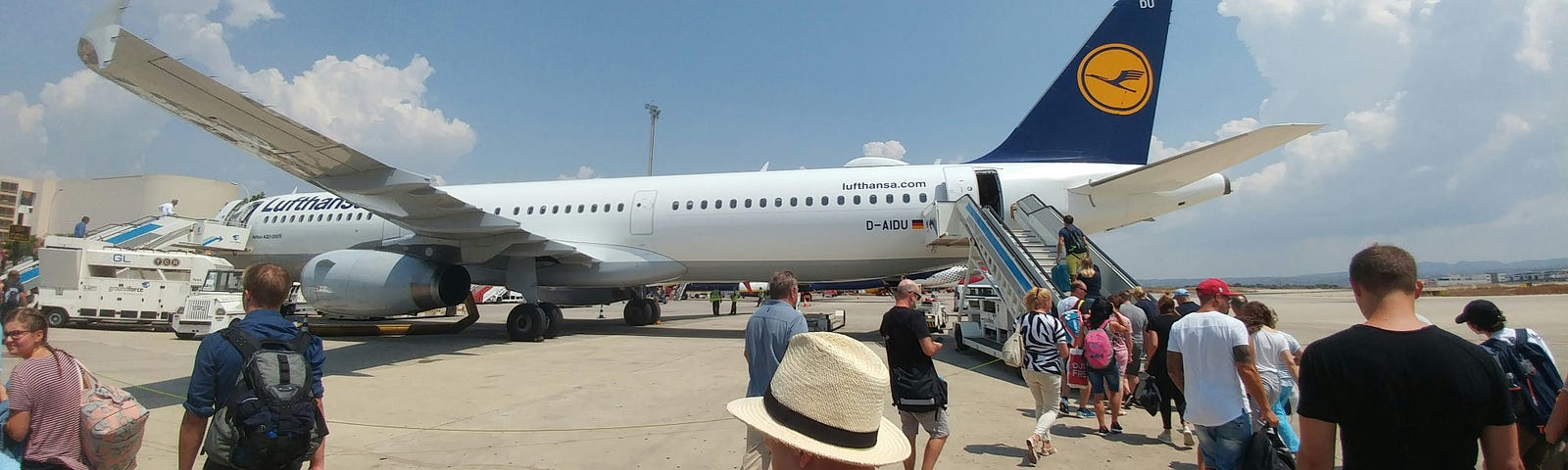 people boarding a plane