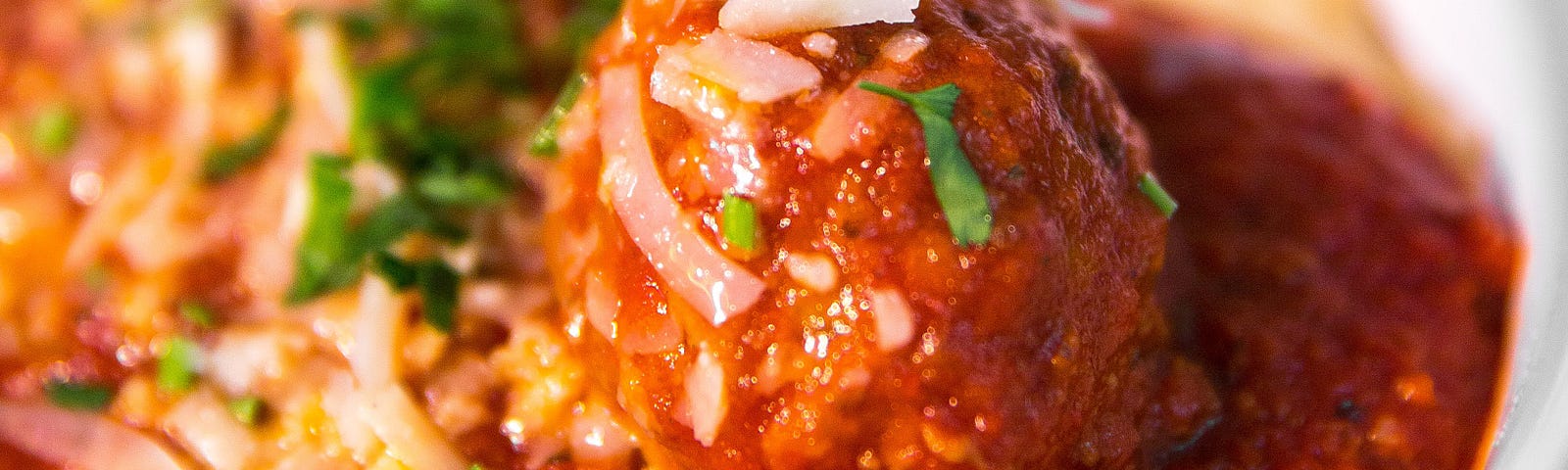 A bowl of pasta with meat sauce.