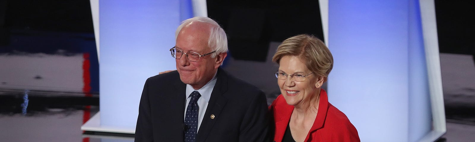 Democratic presidential candidates Senator Bernie Sanders and Senator Elizabeth Warren take stage at the Democratic Debates.