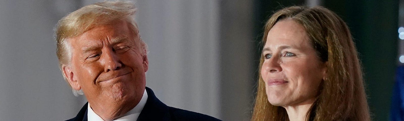 President Donald Trump and Amy Coney Barrett stand on the Blue Room Balcony after her confirmation vote passed in the Senate.