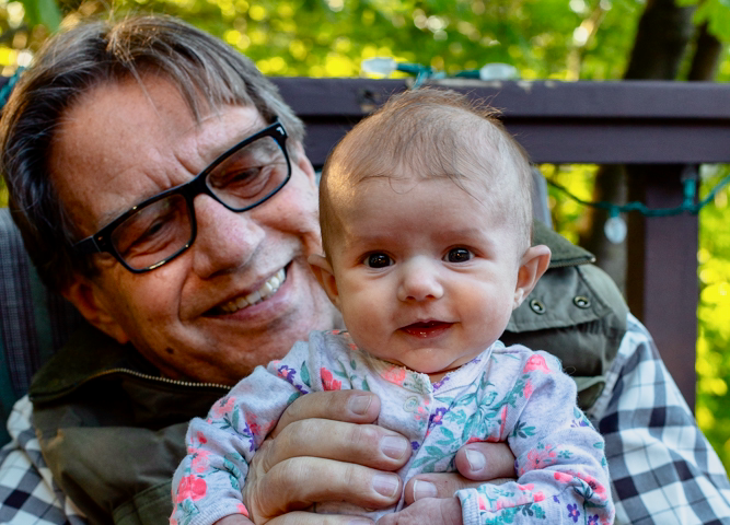 The author, Scott, holding is infant granddaughter, Olivia