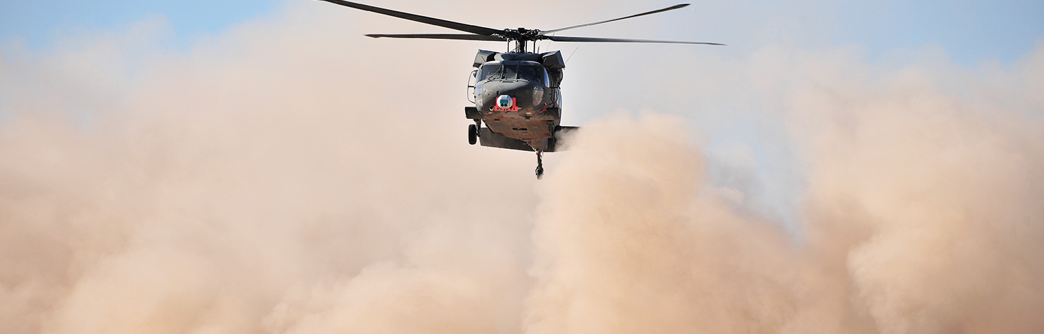 Photo of helicopter and dust.