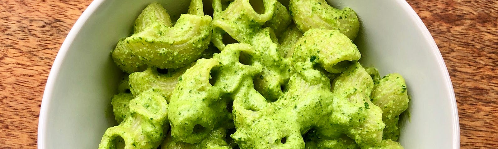 Scroll on to learn about the kale-almond pesto coating these lumache.