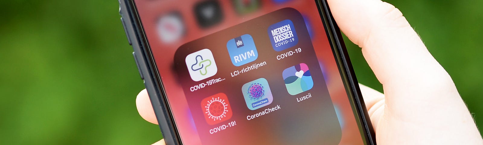 A photo of coronavirus-related apps on a person’s iPhone home screen.