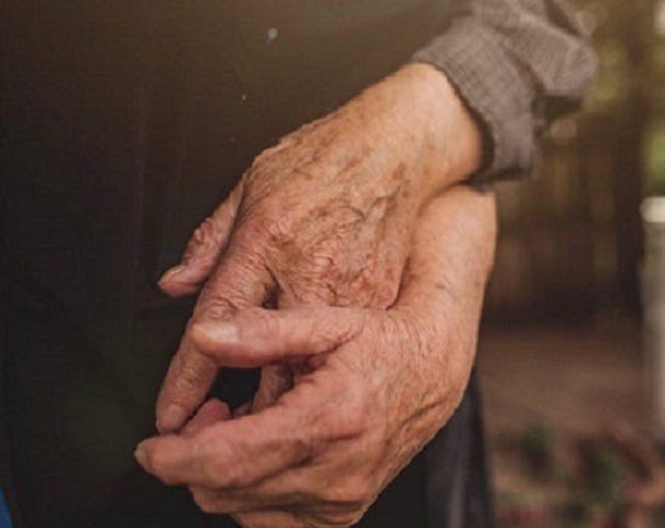 Picture of an old couple holding hands (just the hands).