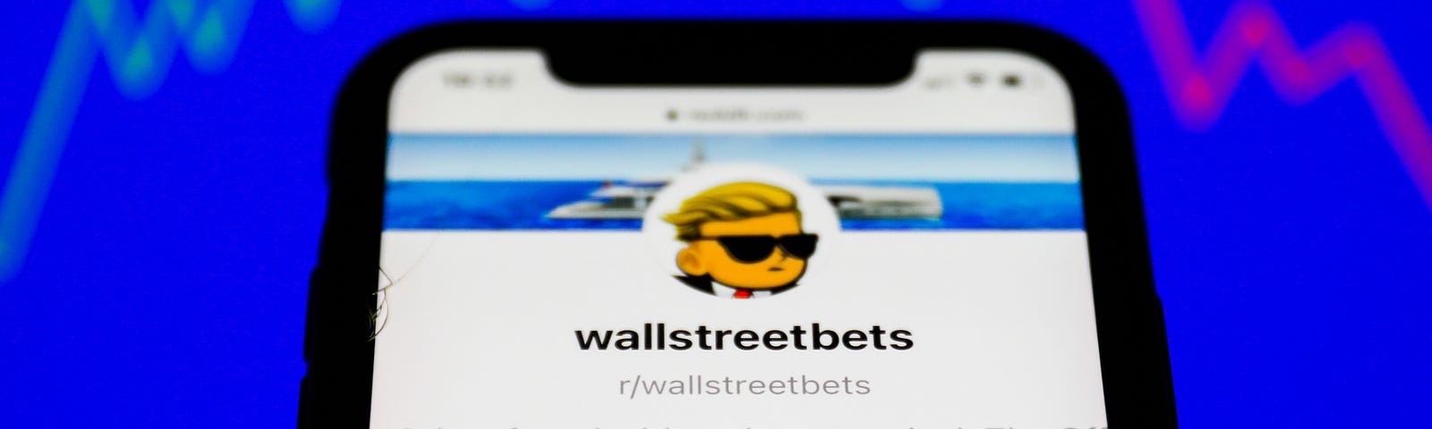 WallStreetBets forum on the Reddit displayed on a phone screen and a illustrative stock chart in the background