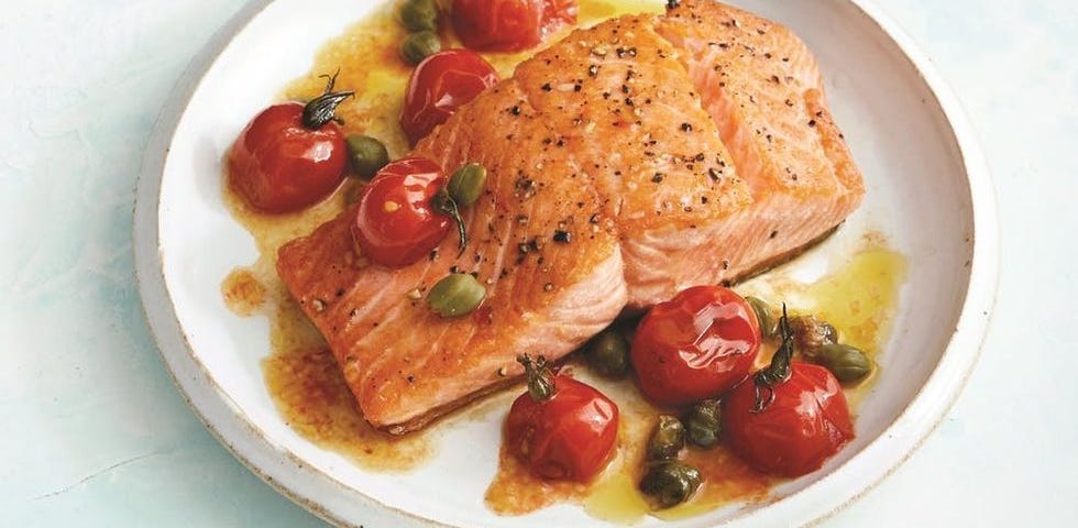 Salmon in a pan and on a plate.