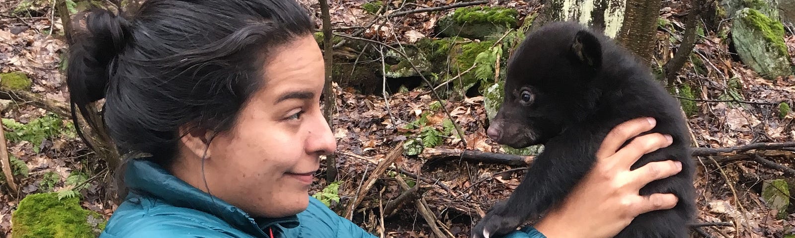 Melissa Gonzalez is a talented photographer and Audiovisual Production Specialist in the Creative Imagery Branch at the National Conservation Training Center. Photo of Melissa holding a black bear cub (Ursus americanus) in the mountains of Western Maryland. Photo Credit: Tiana Jones, USFWS